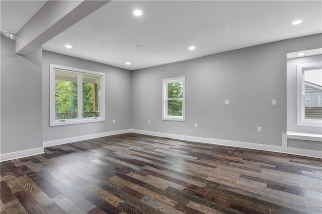 spare room with dark wood-type flooring