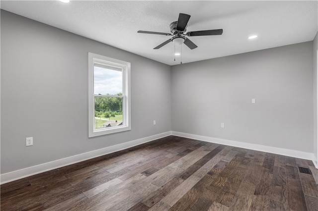 spare room with hardwood / wood-style flooring and ceiling fan