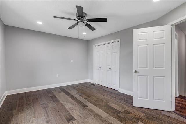 unfurnished bedroom with a closet, ceiling fan, and dark hardwood / wood-style flooring