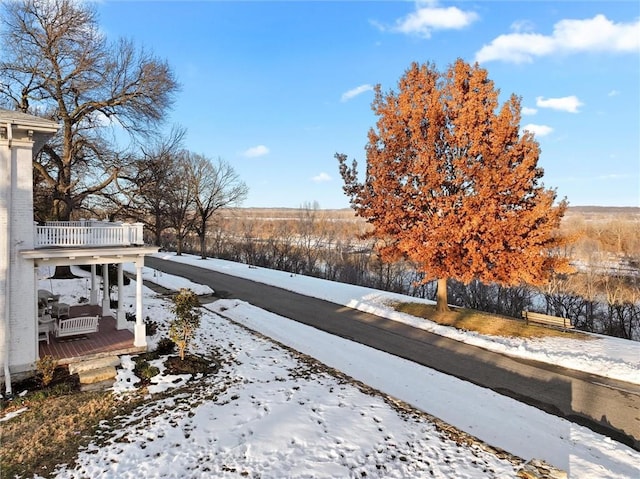 view of yard layered in snow