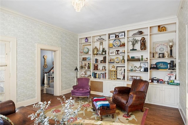 living area featuring dark hardwood / wood-style flooring and ornamental molding