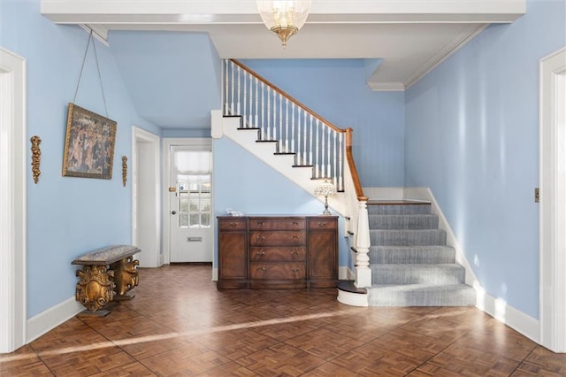 stairs with parquet flooring and ornamental molding