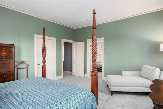 bedroom with ornamental molding and light carpet