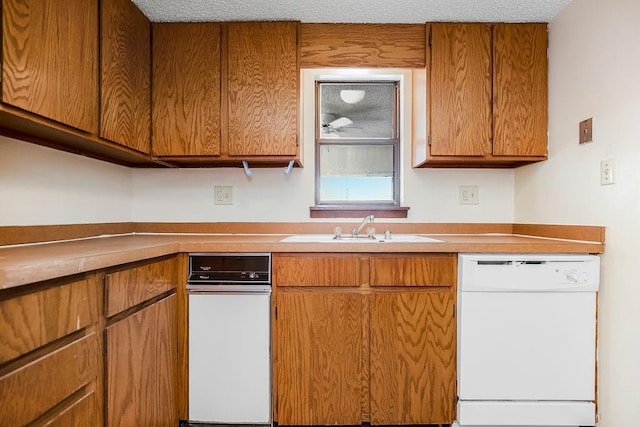 kitchen featuring dishwasher and sink