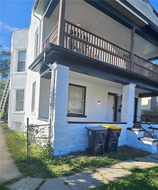 view of home's exterior with a balcony