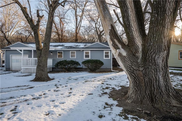 view of front of property featuring a garage and a porch