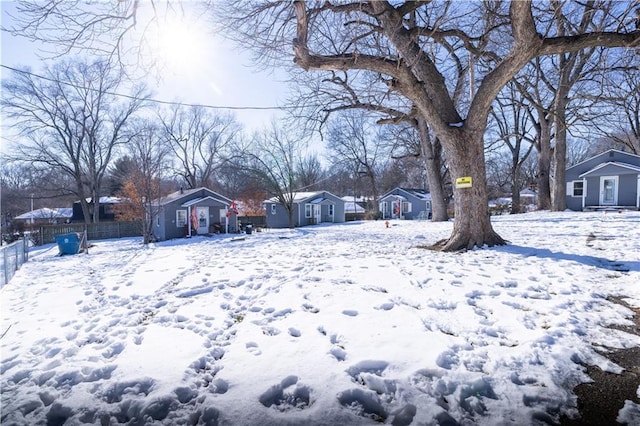 view of yard layered in snow