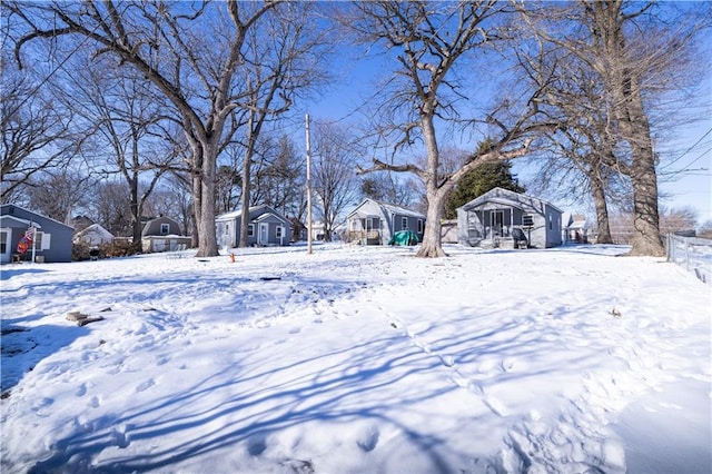 view of yard layered in snow