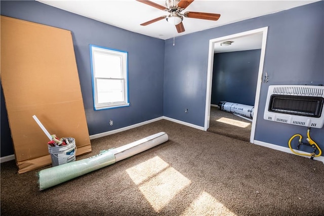 unfurnished bedroom featuring carpet, heating unit, and ceiling fan