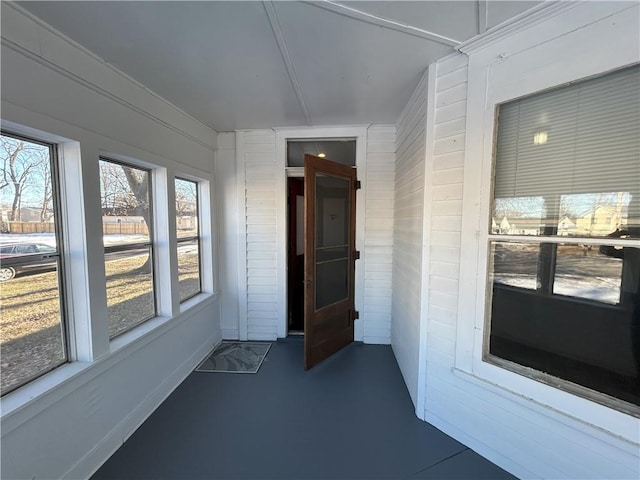 unfurnished sunroom featuring a wealth of natural light