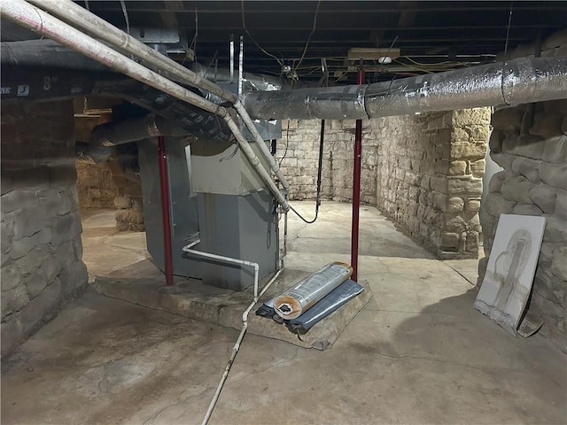 basement featuring heating unit