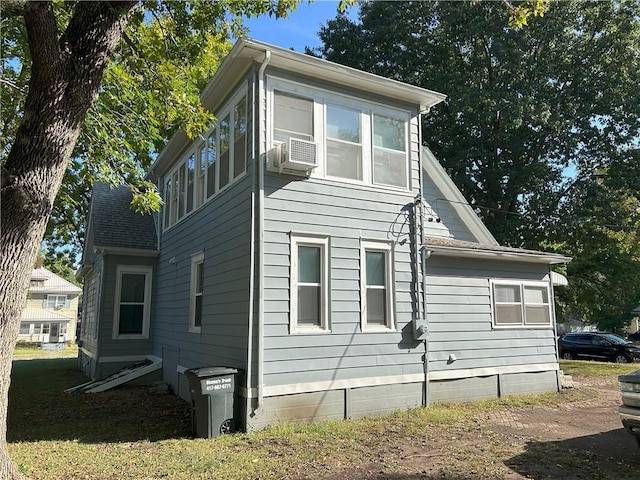 view of side of home with cooling unit