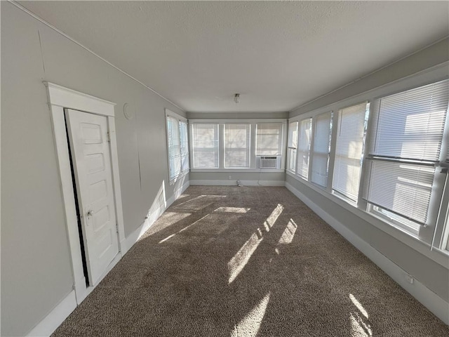 unfurnished sunroom featuring cooling unit