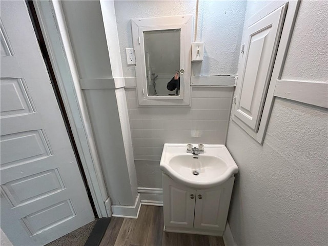 bathroom featuring hardwood / wood-style flooring and vanity