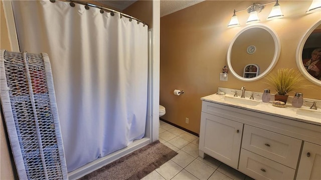 bathroom featuring a textured ceiling, tile patterned flooring, vanity, toilet, and a shower with shower curtain