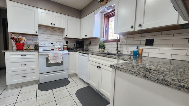 kitchen with white cabinetry, sink, and white appliances