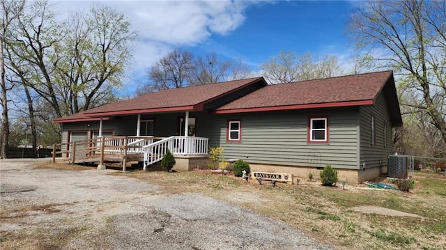 6539 Quaker Rd, Galena, KS 66739 - ranch-style home featuring a porch, roof with shingles, and central AC unit