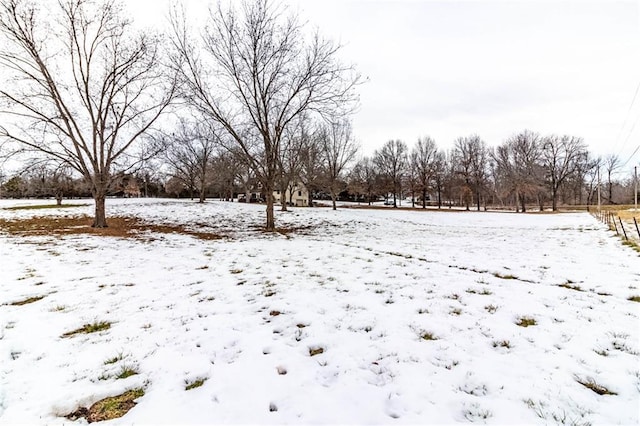 view of yard layered in snow