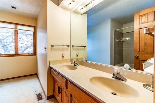 bathroom featuring vanity and a textured ceiling