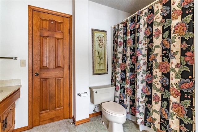 bathroom with toilet and vanity