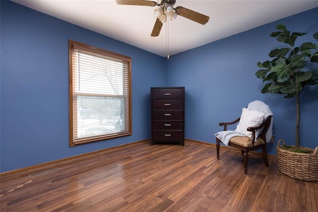 unfurnished room featuring ceiling fan and dark hardwood / wood-style flooring