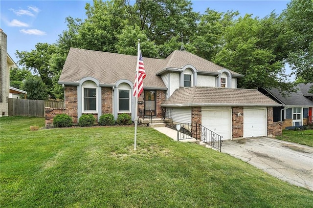 4722 Switzer Rd, Shawnee, KS 66203 - view of front of home featuring driveway, a garage, brick siding, and a shingled roof
