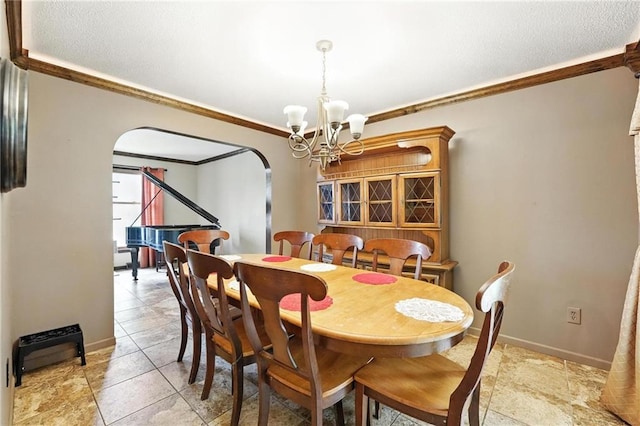4722 Switzer Rd, Shawnee, KS 66203 - dining room with arched walkways, ornamental molding, a chandelier, and a textured ceiling