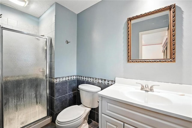 4722 Switzer Rd, Shawnee, KS 66203 - full bath featuring tile walls, vanity, a stall shower, and a wainscoted wall