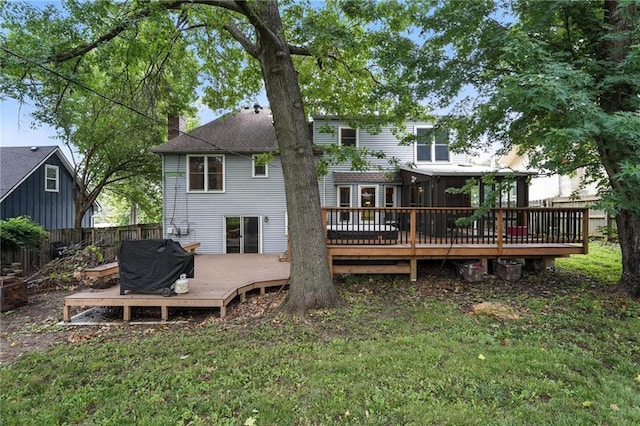 4722 Switzer Rd, Shawnee, KS 66203 - back of house featuring a wooden deck and a chimney