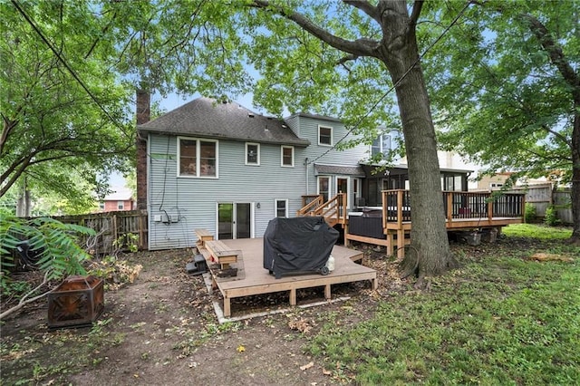 4722 Switzer Rd, Shawnee, KS 66203 - rear view of property with a chimney, a wooden deck, and a fire pit