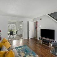 living room with dark hardwood / wood-style floors