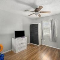 unfurnished bedroom featuring ceiling fan and wood-type flooring