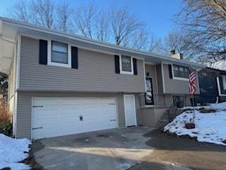 bi-level home featuring a garage