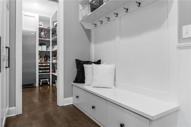 mudroom featuring dark wood-style floors and baseboards