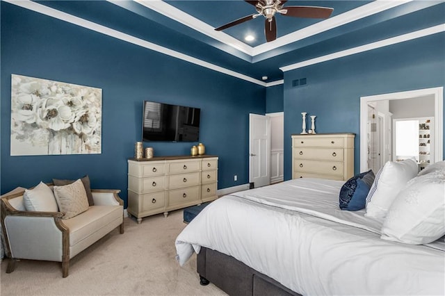 carpeted bedroom with crown molding, visible vents, and ceiling fan