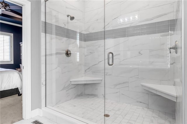 full bathroom featuring a stall shower and ensuite bathroom