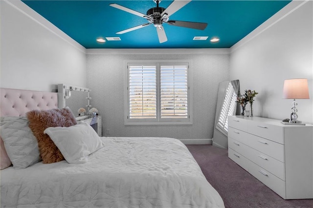 bedroom featuring ceiling fan, carpet flooring, visible vents, baseboards, and ornamental molding