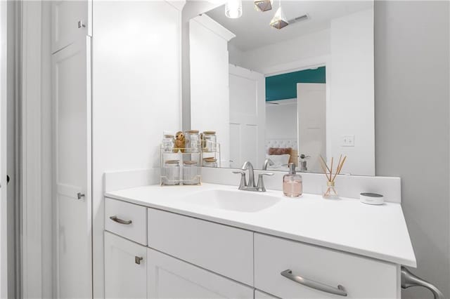 bathroom featuring visible vents and vanity