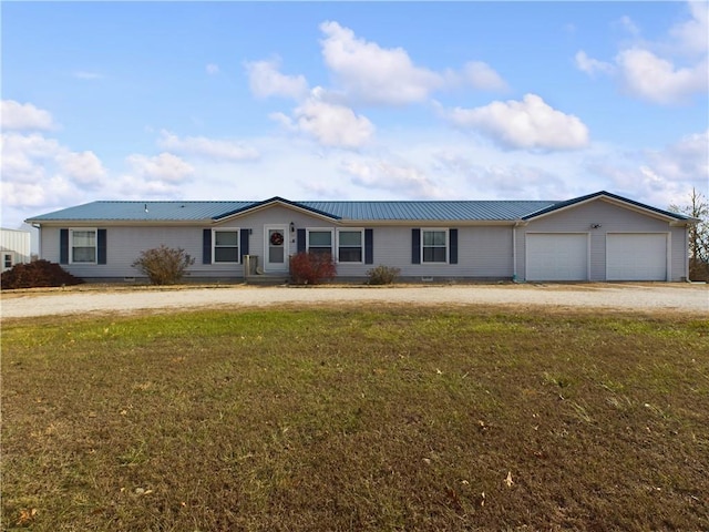 single story home with a front yard and a garage