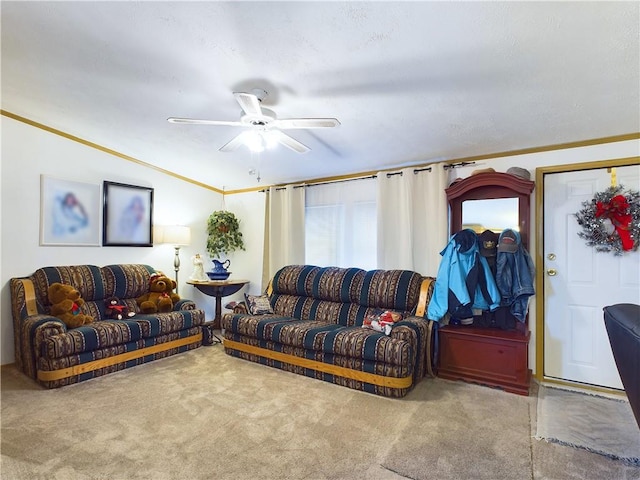 carpeted living room featuring ceiling fan and ornamental molding