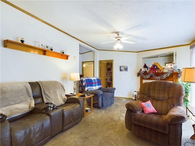 carpeted living room with ceiling fan and crown molding