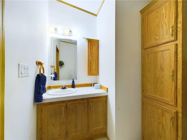 bathroom with vanity and crown molding