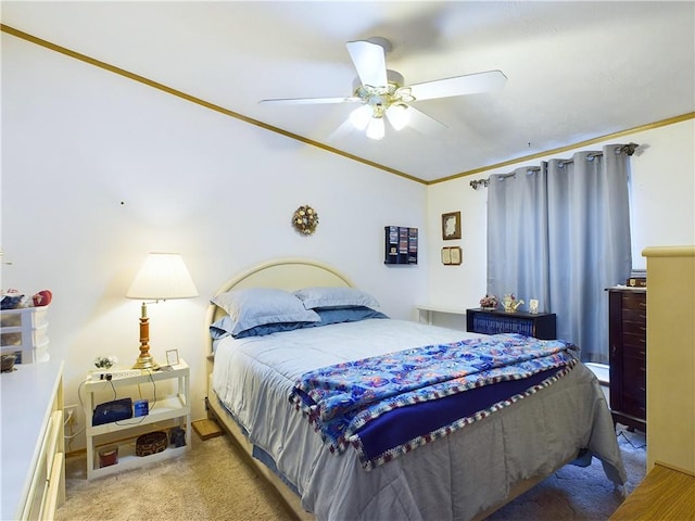 bedroom featuring ceiling fan, light carpet, and crown molding