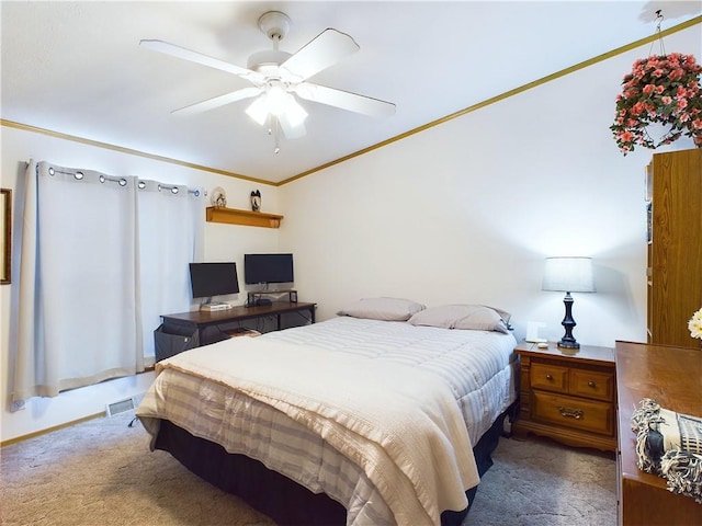 carpeted bedroom featuring ceiling fan and ornamental molding