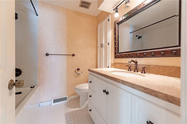 full bathroom featuring toilet, tiled shower / bath combo, tile patterned flooring, and vanity