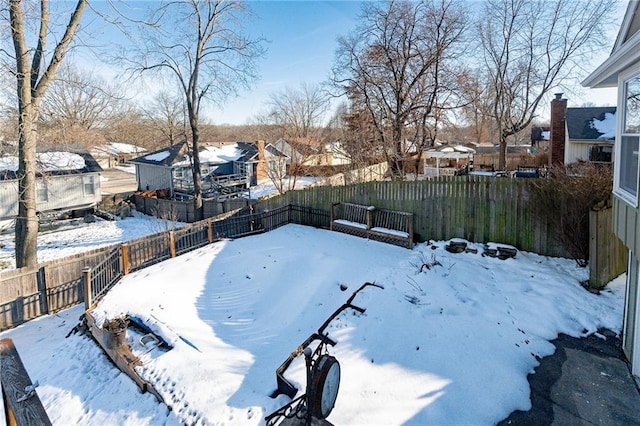 view of yard layered in snow