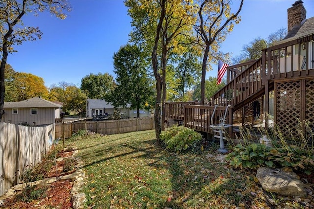 view of yard featuring a wooden deck