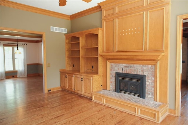 unfurnished living room with light wood-style flooring, baseboards, and visible vents