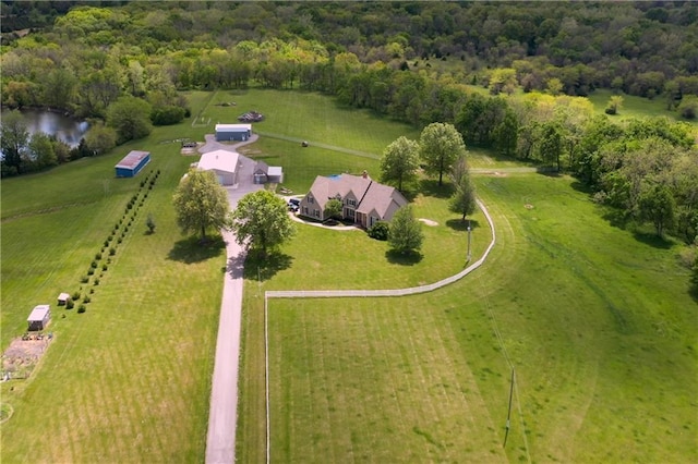 birds eye view of property with a water view, a rural view, and a forest view
