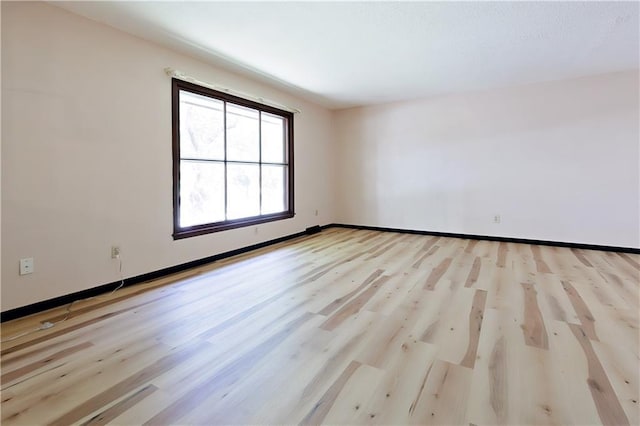 unfurnished room featuring light wood-type flooring